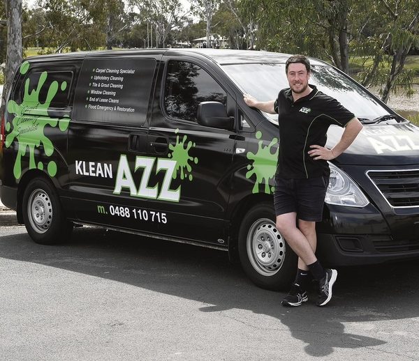 Aaron Jennings beside the KleanAZZ van.